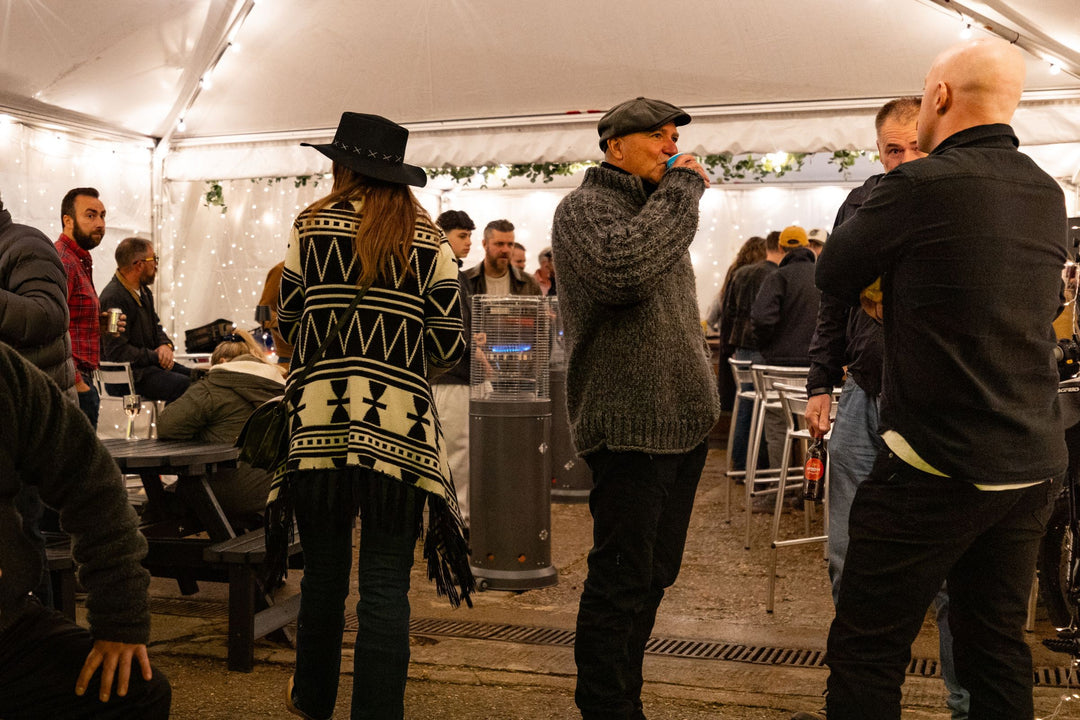 Crowd of riders socialising inside the Machinehead Moto 1 Big Bash marquee