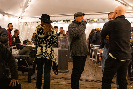 Crowd of riders socialising inside the Machinehead Moto 1 Big Bash marquee