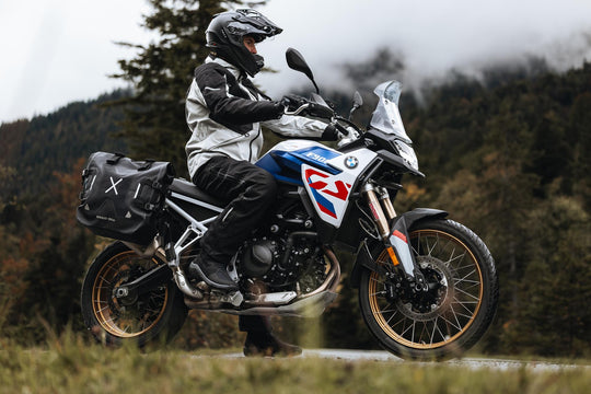 Boundless H2O ADV Footwear worn by a rider on an adventure motorcycle.

