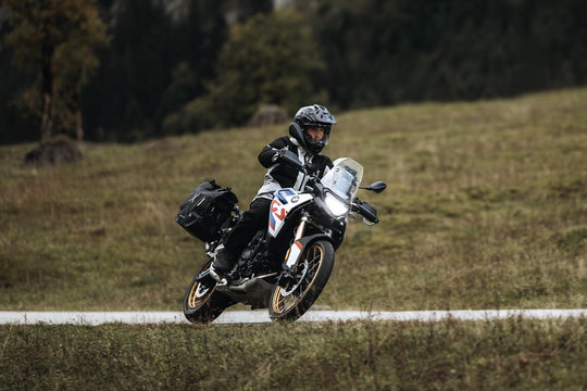 Boundless H2O ADV Footwear worn by a rider cornering on an adventure motorcycle.