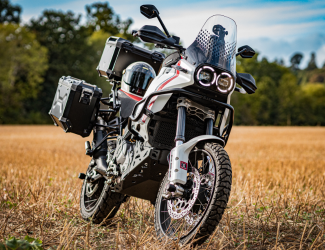 Ducati DesertX adventure bike fitted with SW-Motech luggage and crash bars at Loseley Park.
