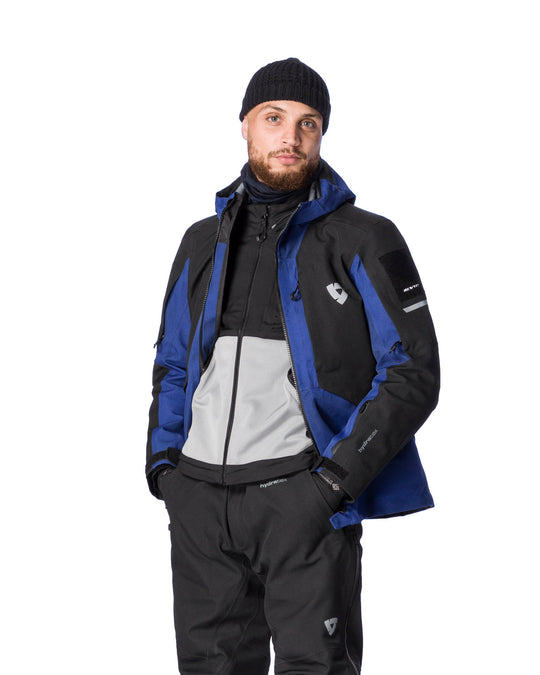 Model wearing REV’IT! Tectonic H2O Jacket, Dark blue - Black, front three quater view