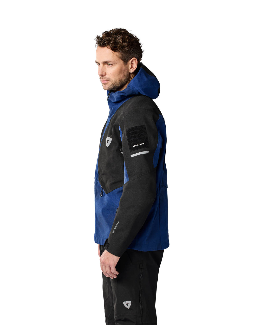 Model wearing REV’IT! Tectonic H2O Jacket, Dark blue - Black, left side view