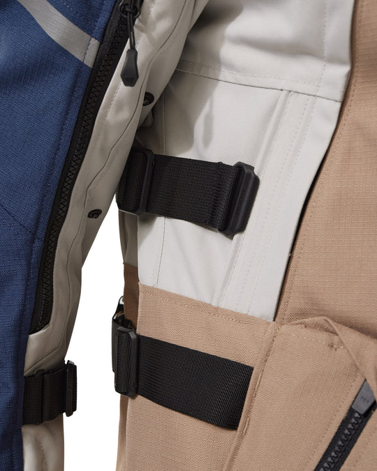 Close-up of side straps on REV’IT! Sand 5 H2O Jacket, Sand-Blue