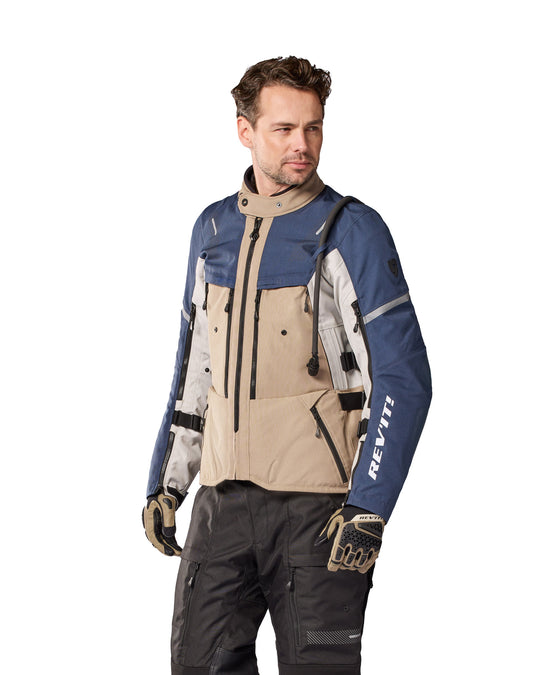Model wearing REV’IT! Sand 5 H2O Jacket, Sand-Blue, three quarter view