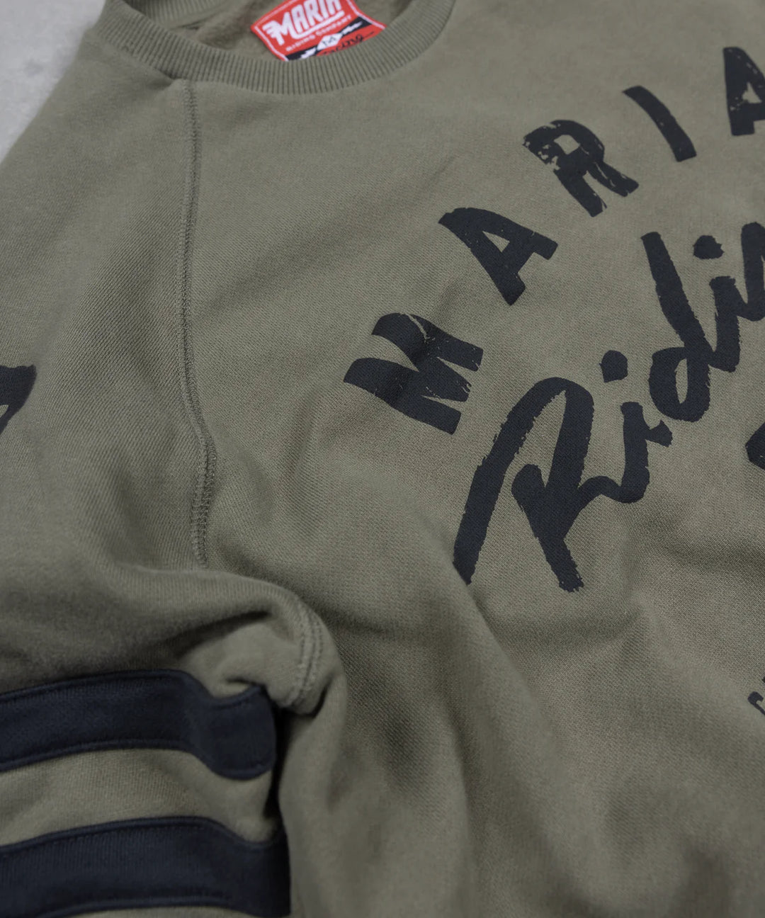 Maria-riding-spades-sweatshirt-army-green-close-up-print