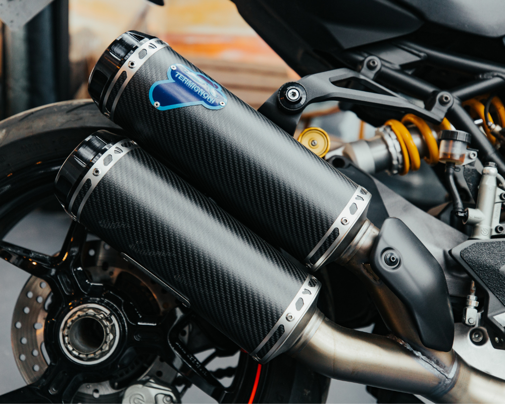 Close-up of Termignoni carbon fibre motorcycle exhaust — example of custom exhaust modification at Machinehead Moto