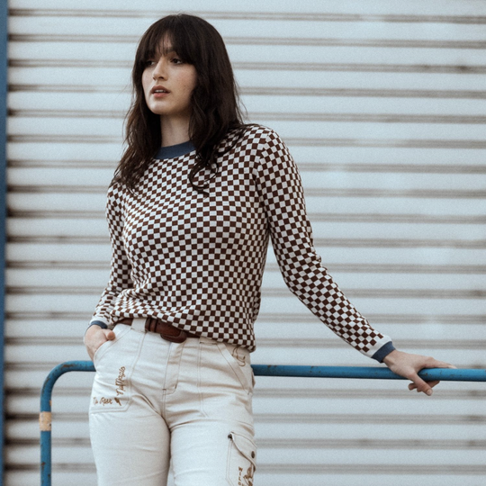 model-holding-wildust-sisters-jumper-brown-check-blue-trim-classics-front