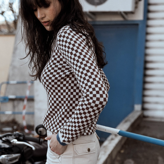 model-holding-wildust-sisters-jumper-classics-side-view