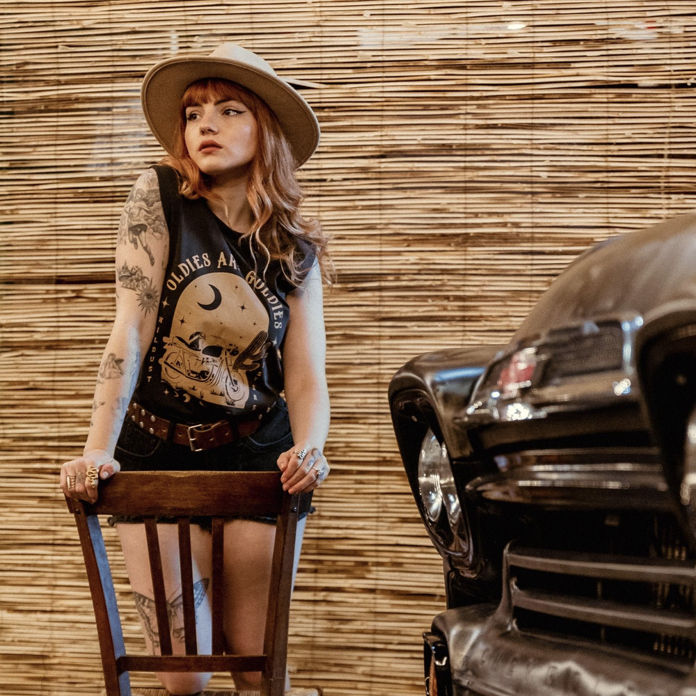 model-wearing-wildust-oldies-are-goodies-tank-camel-print-motorcycle-moon-stars