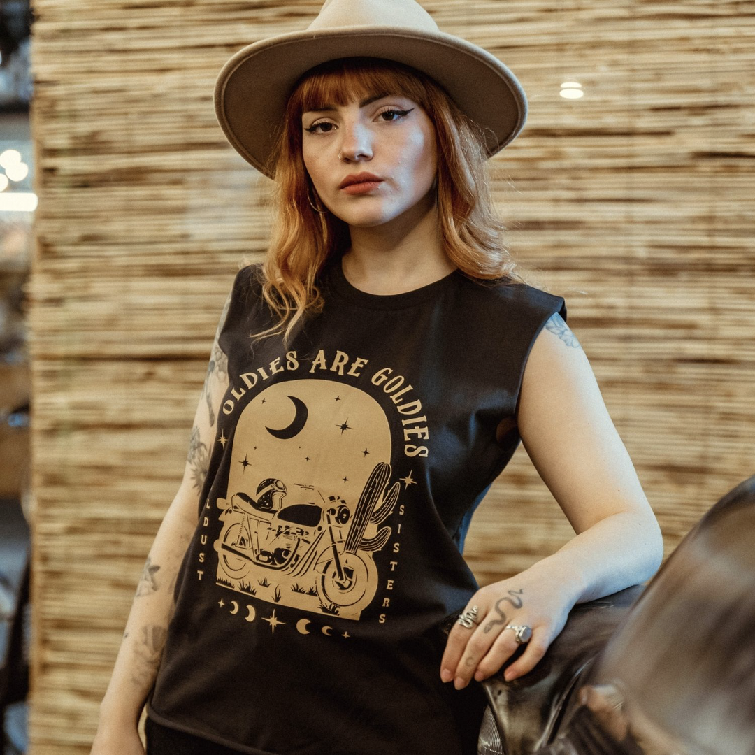 model-wearing-hat-wildust-oldies-tank-camel-print-black-front