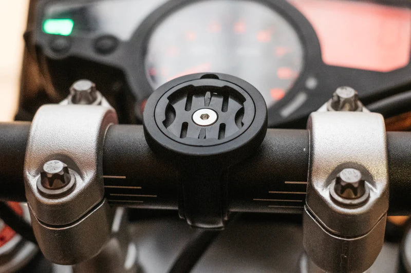Beeline Moto II Bar Clamp Mount installed on motorcycle handlebars with dashboard in background