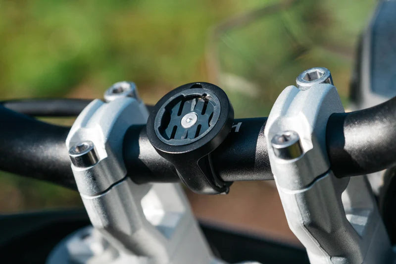 Beeline Moto II Bar Clamp Mount fitted to motorcycle handlebars in natural light
