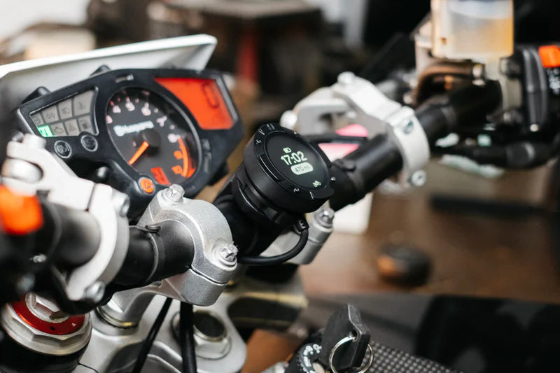 Beeline Moto II Powered Mount installed on motorcycle handlebars with dashboard in view