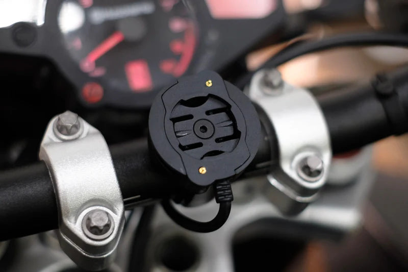 Beeline Moto II Powered Mount installed on motorcycle handlebar with cable connected