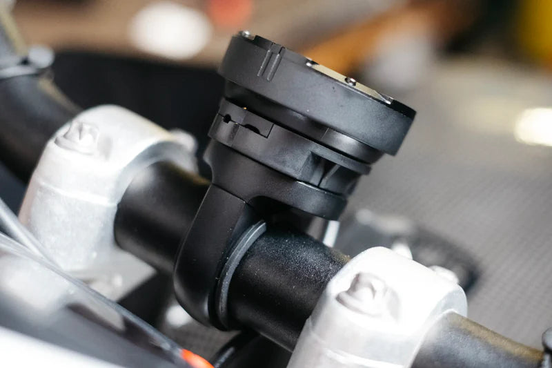 Beeline Moto II Powered Mount installed on motorcycle handlebars, side view close-up