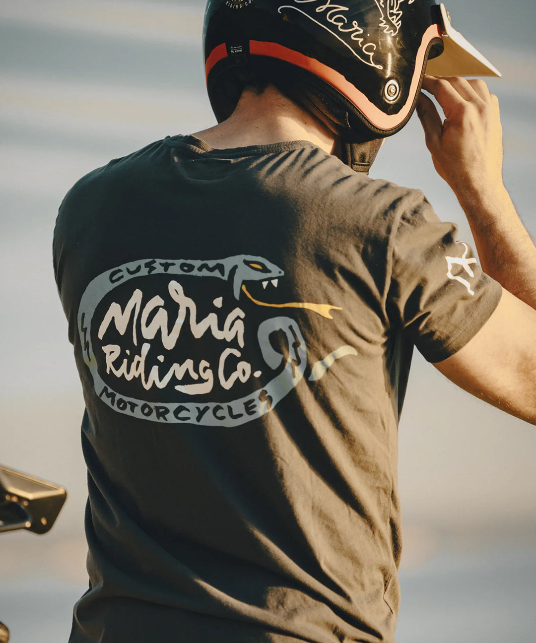 maria-riding-dark-grey-veneno-t-shirt-reverse-print-rider-wearing-helmet