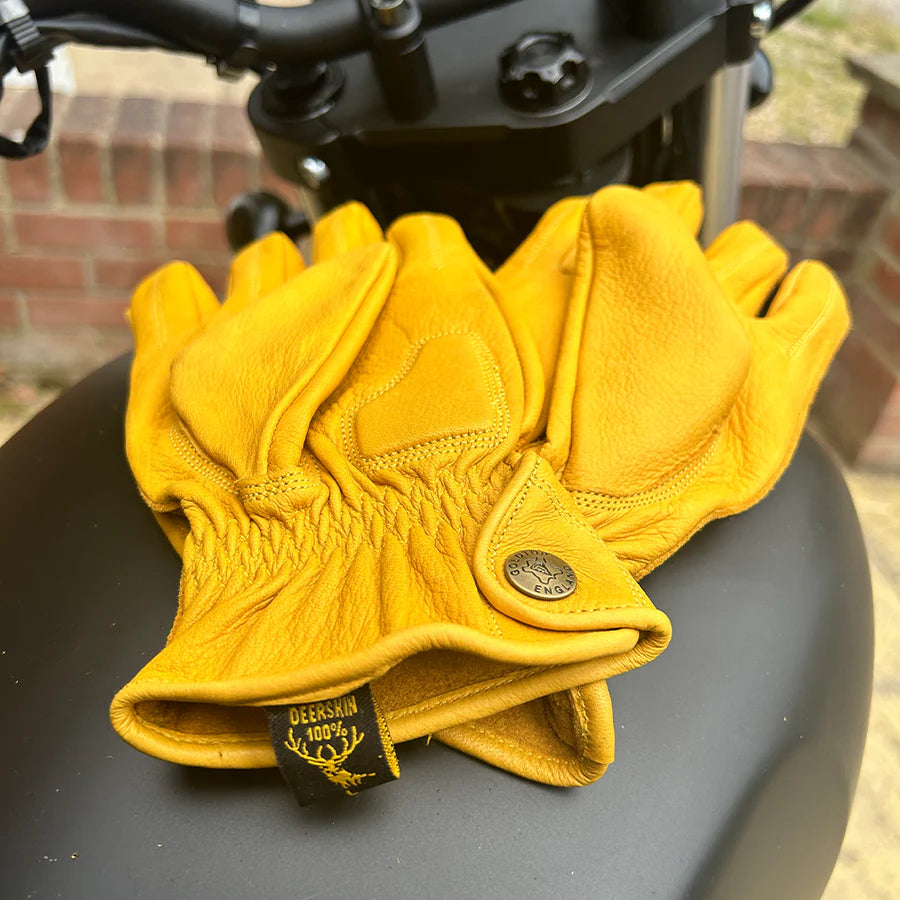 flat-left-and-right-goldtop-deerskin-leather-motorcycle-gloves-midlength-gold-colour-on-motorcycle-tank