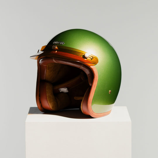 Front left side view on Hedon Hedonist Helmet - Olivea with peak 