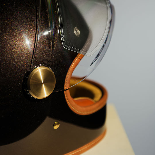 Right side close-up of visor mechanism on   Hedon Heroine Racer 2.0 Helmet - Macadamia with clear visor open 