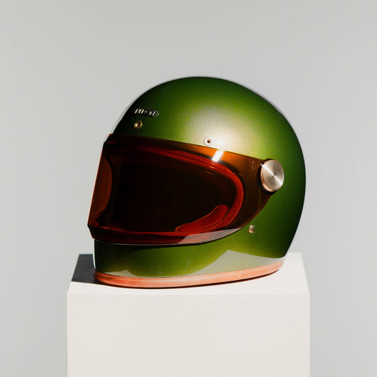 Front left side view of Hedon Heroine Racer 2.0 Helmet - Olivea with tinted visor closed