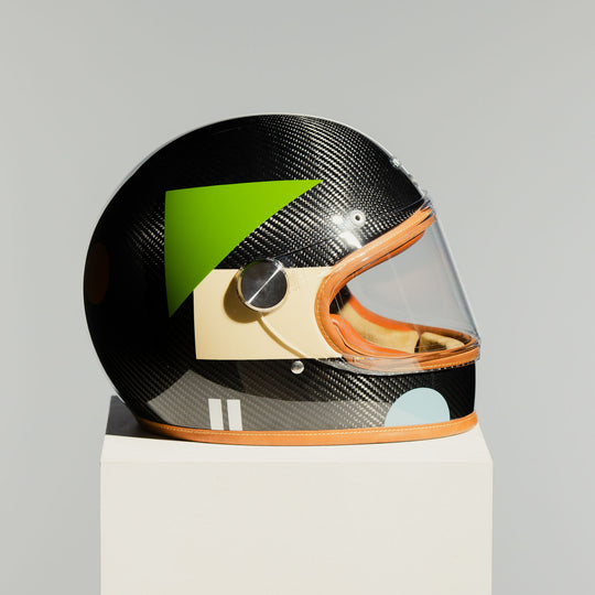 Left side view of the Hedon Heroine Racer 2.0 Helmet – Bauhaus with clear visor closed.