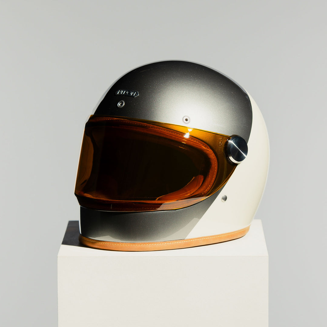 Front left side view of the Hedon Heroine Racer 2.0 Helmet – Camelot with the tinted visor closed