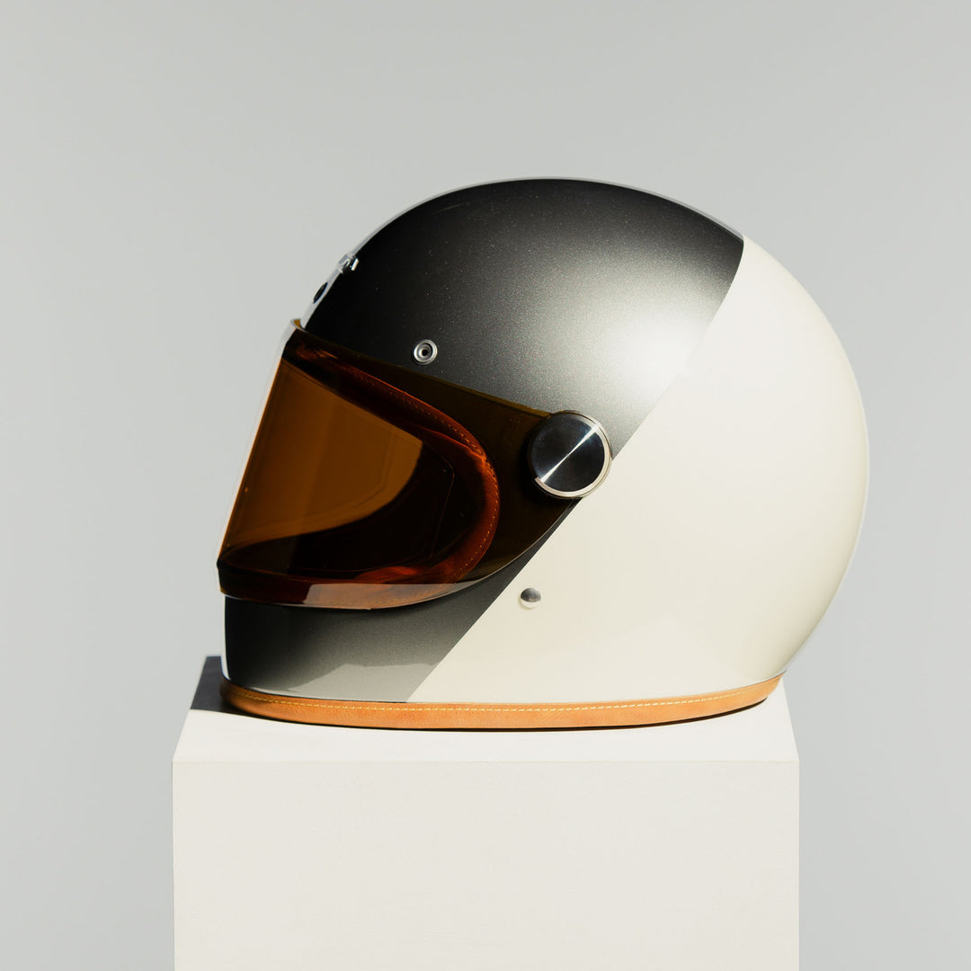 Left side view of the Hedon Heroine Racer 2.0 Helmet – Camelot with the tinted visor closed