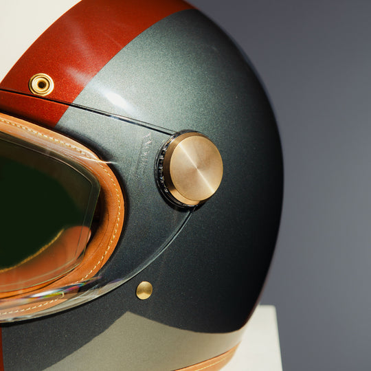Left side close-up of visor mechanism on Hedon Heroine Racer Helmet - Eastwood with clear visor closed