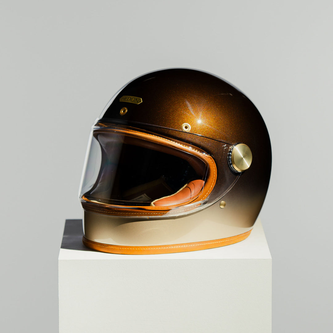 Front left side view of Hedon Heroine Racer Helmet - Polvo with clear visor closed