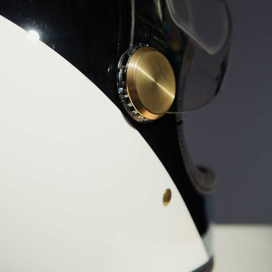 Close-up of rear right side visor mechanical detail on Hedon Heroine Racer 2.0 Helmet - Two Face with clear visor open 