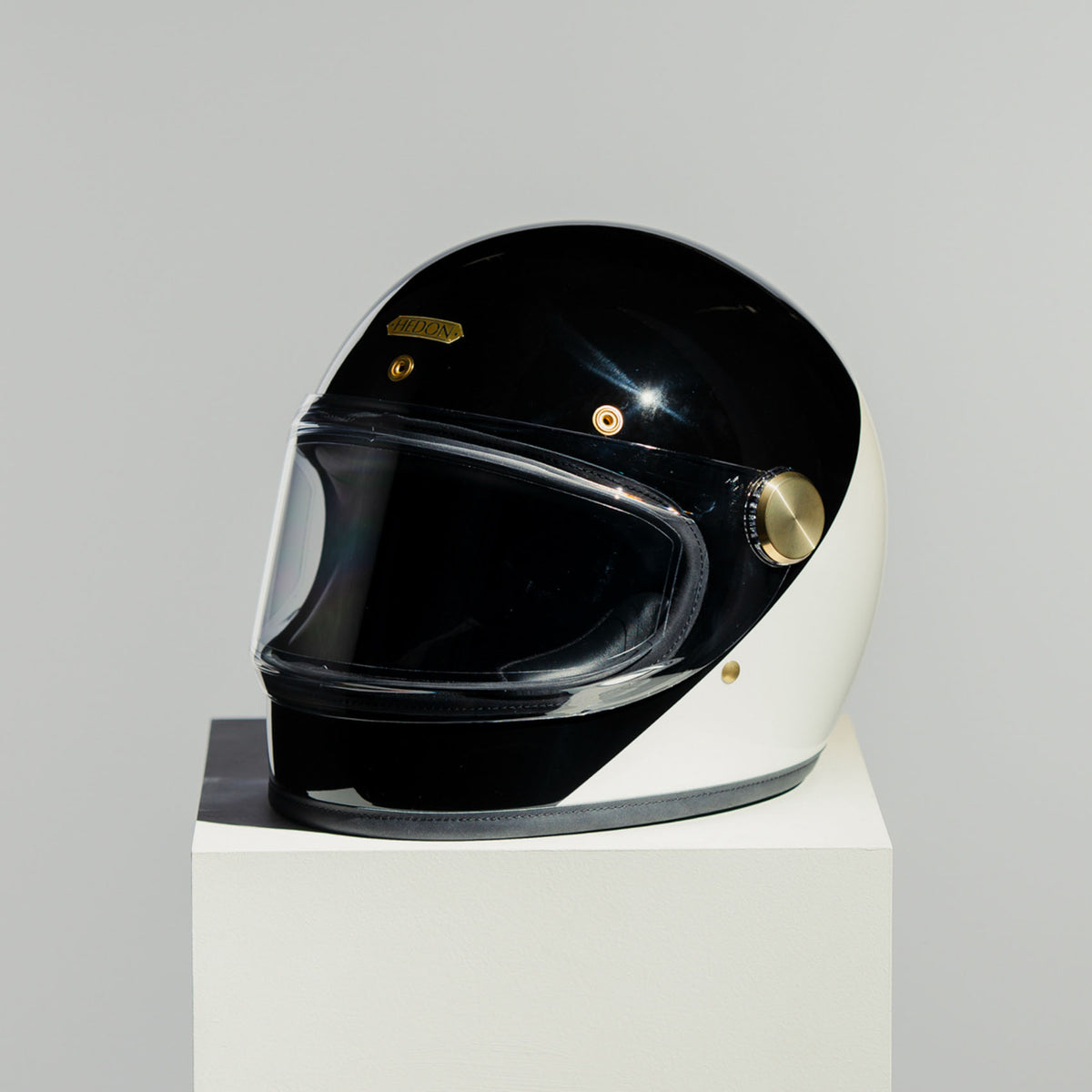 Front left view of Hedon Heroine Racer 2.0 Helmet - Two Face with clear visor down 
