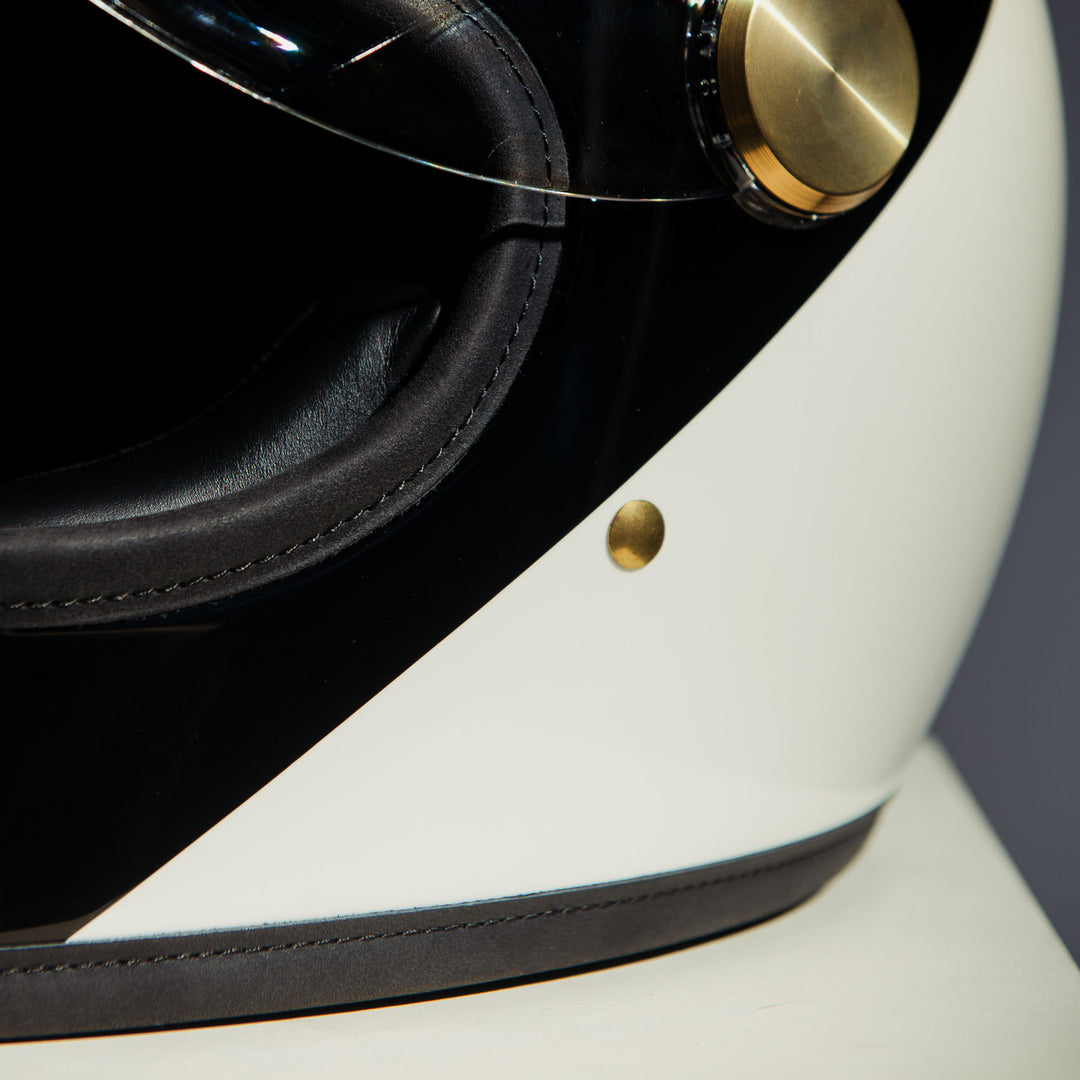 Close-up of left side on Hedon Heroine Racer 2.0 Helmet - Two Face with clear visor open 