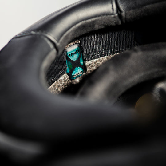 Close-up interior view of the Hedon Psilo Explorer Helmet – Commander, highlighting the premium leather lining, comfort padding, and integrated Quin smart safety module.