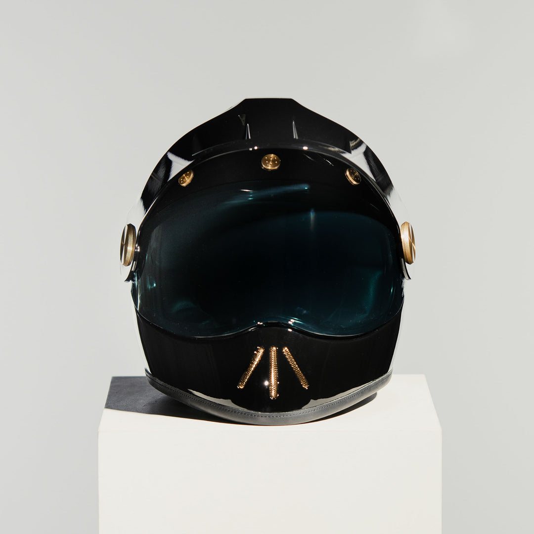 Front view of Hedon Psilo Explorer Helmet - Signature Black with tinted visor down 