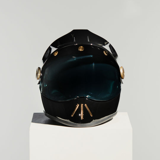 Front view of Hedon Psilo Explorer Helmet - Signature Black with tinted visor down 