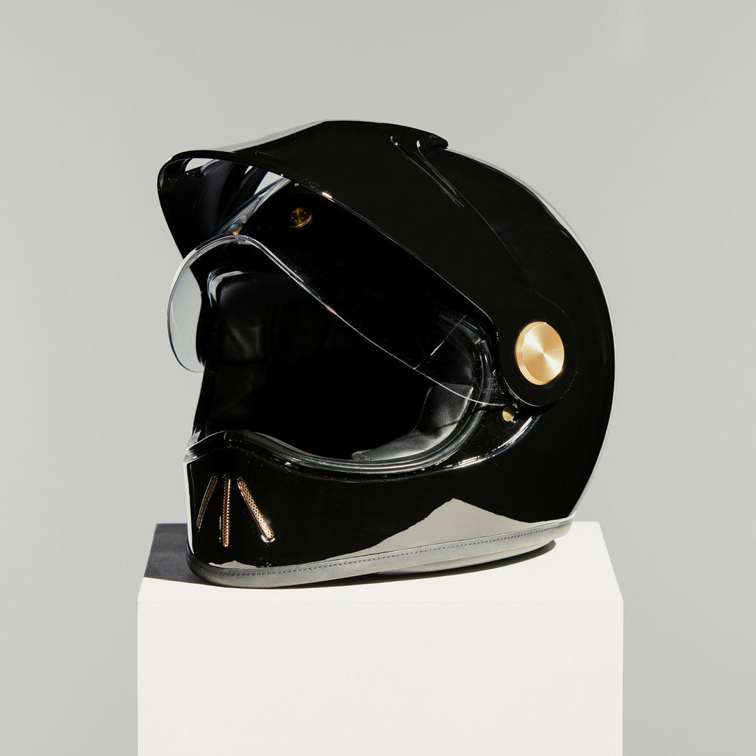 Front left view of Hedon Psilo Explorer Helmet - Signature Black with clear visor open 