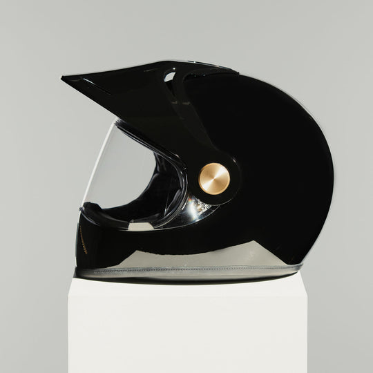 Left side view of Hedon Psilo Explorer Helmet - Signature Black with clear visor down