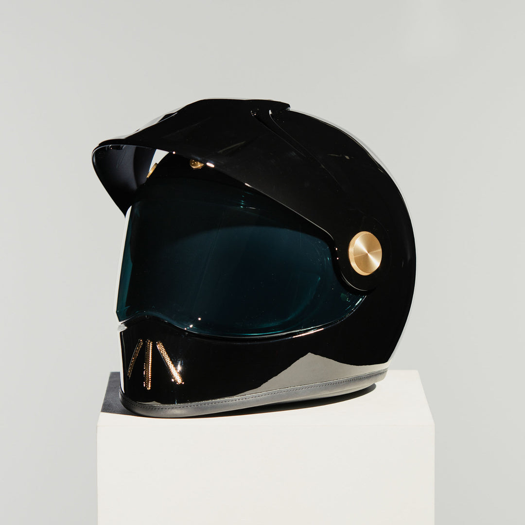 Front left view of Hedon Psilo Explorer Helmet - Signature Black with tinted visor down