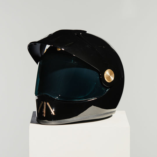 Front left view of Hedon Psilo Explorer Helmet - Signature Black with tinted visor down
