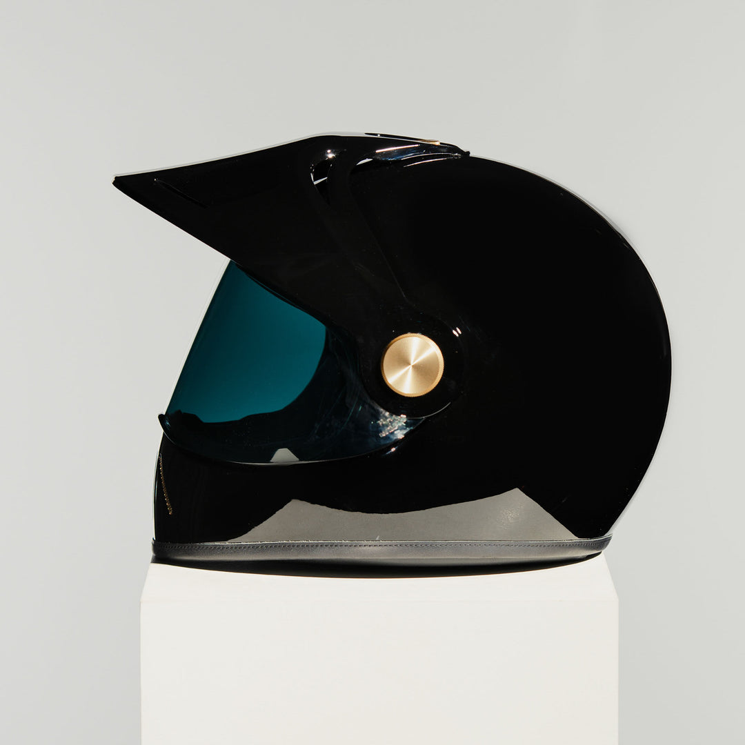 Left side view of Hedon Psilo Explorer Helmet - Signature Black with tinted visor down