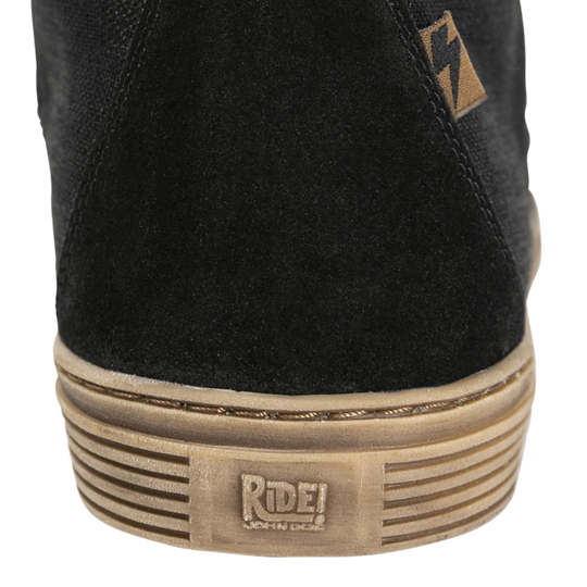 Close-up of the John Doe Neo Black high-top Trainer heel with ‘Ride!’ branding on the sole