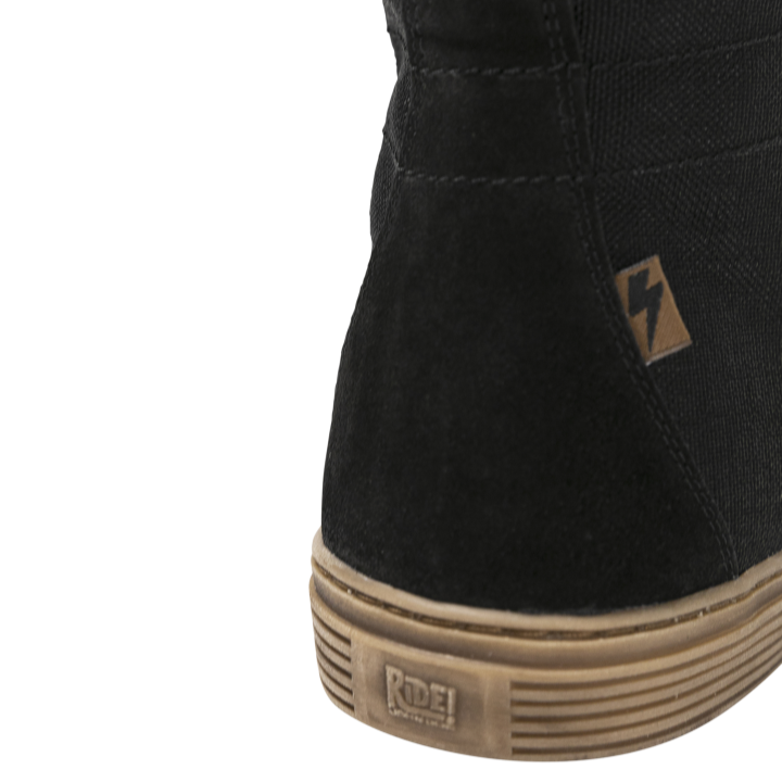 Close-up of the John Doe Neo Black high-top Trainer with logo tab and Ride! branding on the sole