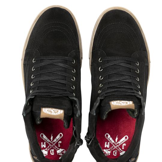 Top-down view of John Doe Neo Black Trainers showing red insoles with white WCDC logo