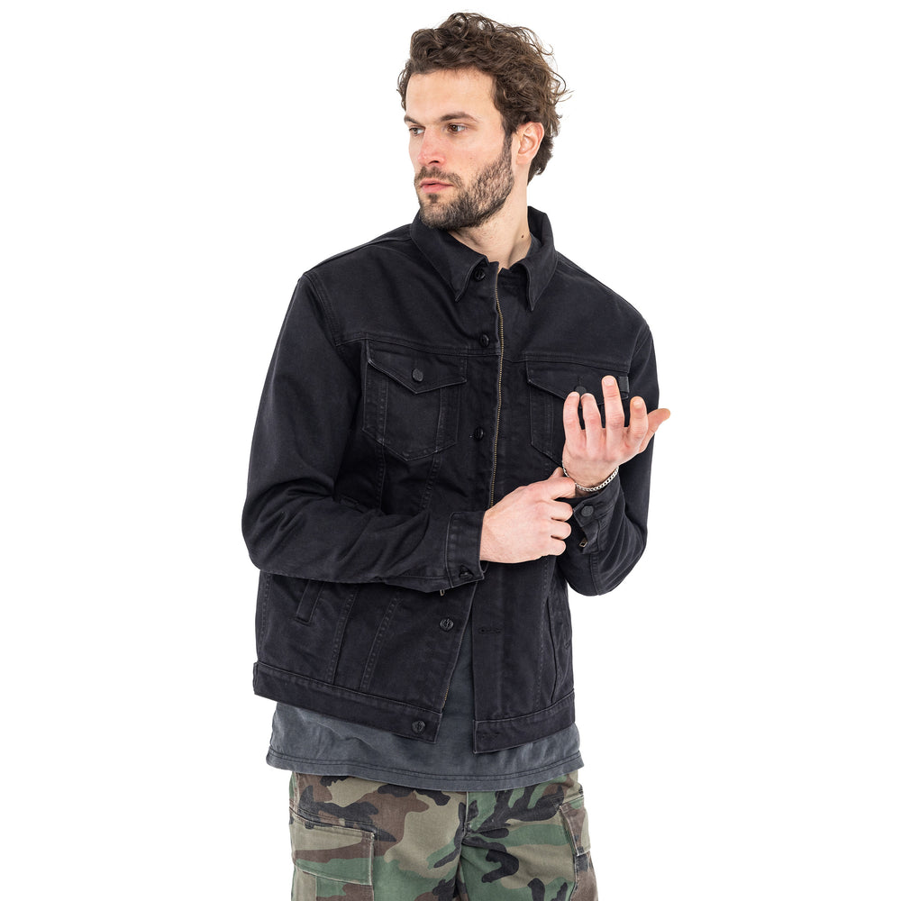 Man wearing the John Doe Maverick jacket in Black Raw denim with grey shirt and camo trousers – front view