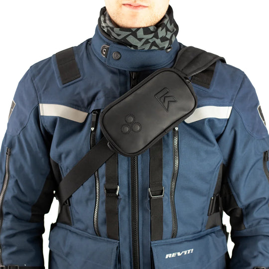 Kriega Harness Pocket XL worn cross-body over motorcycle jacket for off-road riding