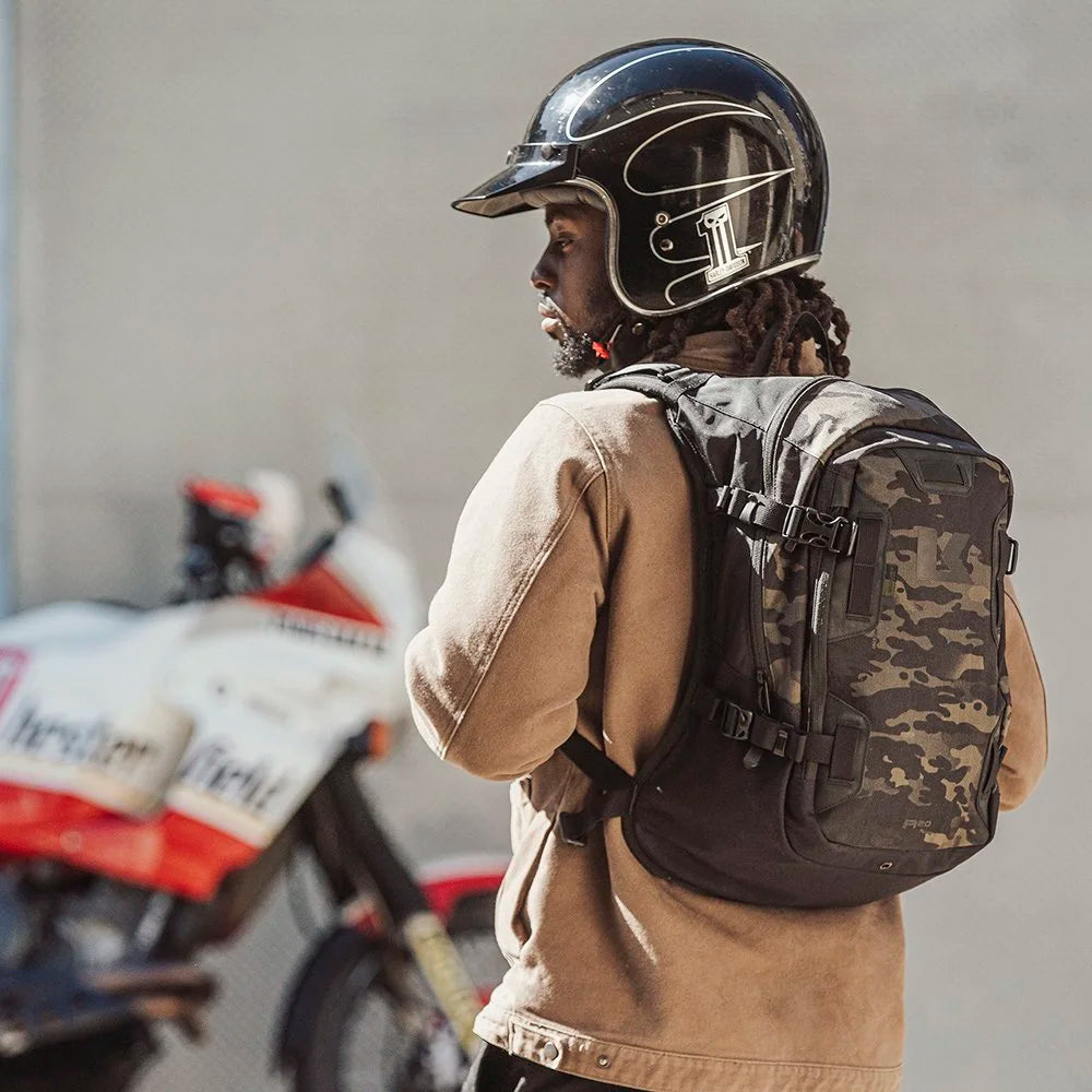 Back view of rider wearing Multicam Black Kriega Backpack R20