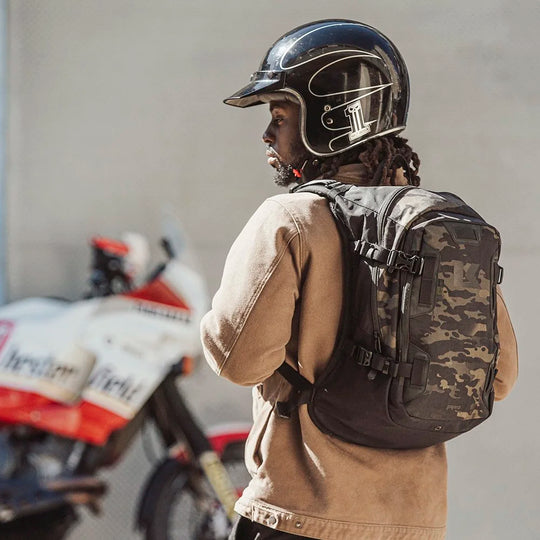 Back view of rider wearing Multicam Black Kriega Backpack R20