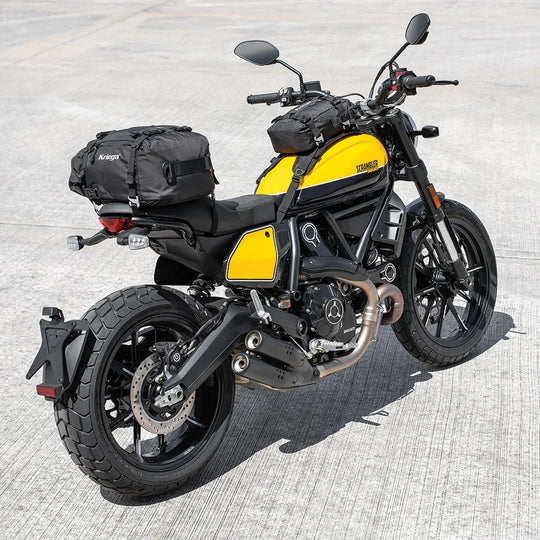 Kriega US-10 Drypack motorcycle tail bag mounted on Ducati Scrambler in yellow