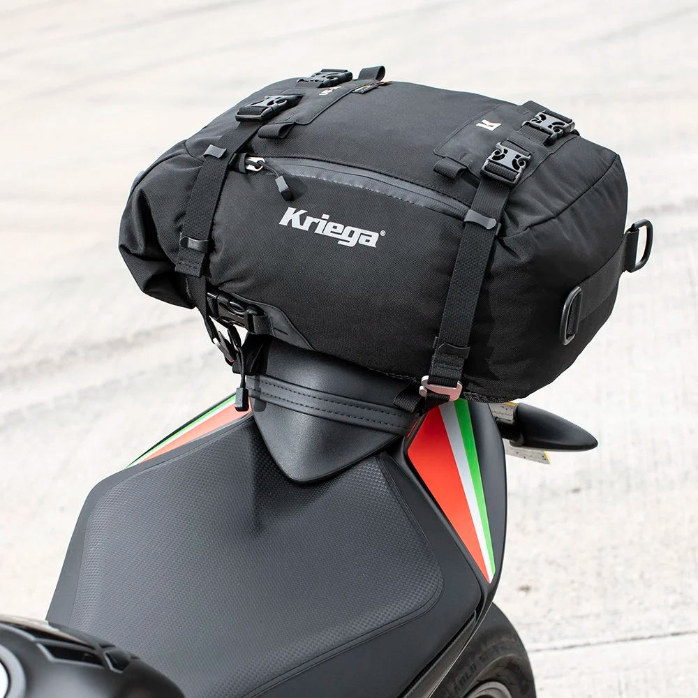 Kriega US-20 Drypack mounted on an Aprilia motorcycle seat with tricolour detailing